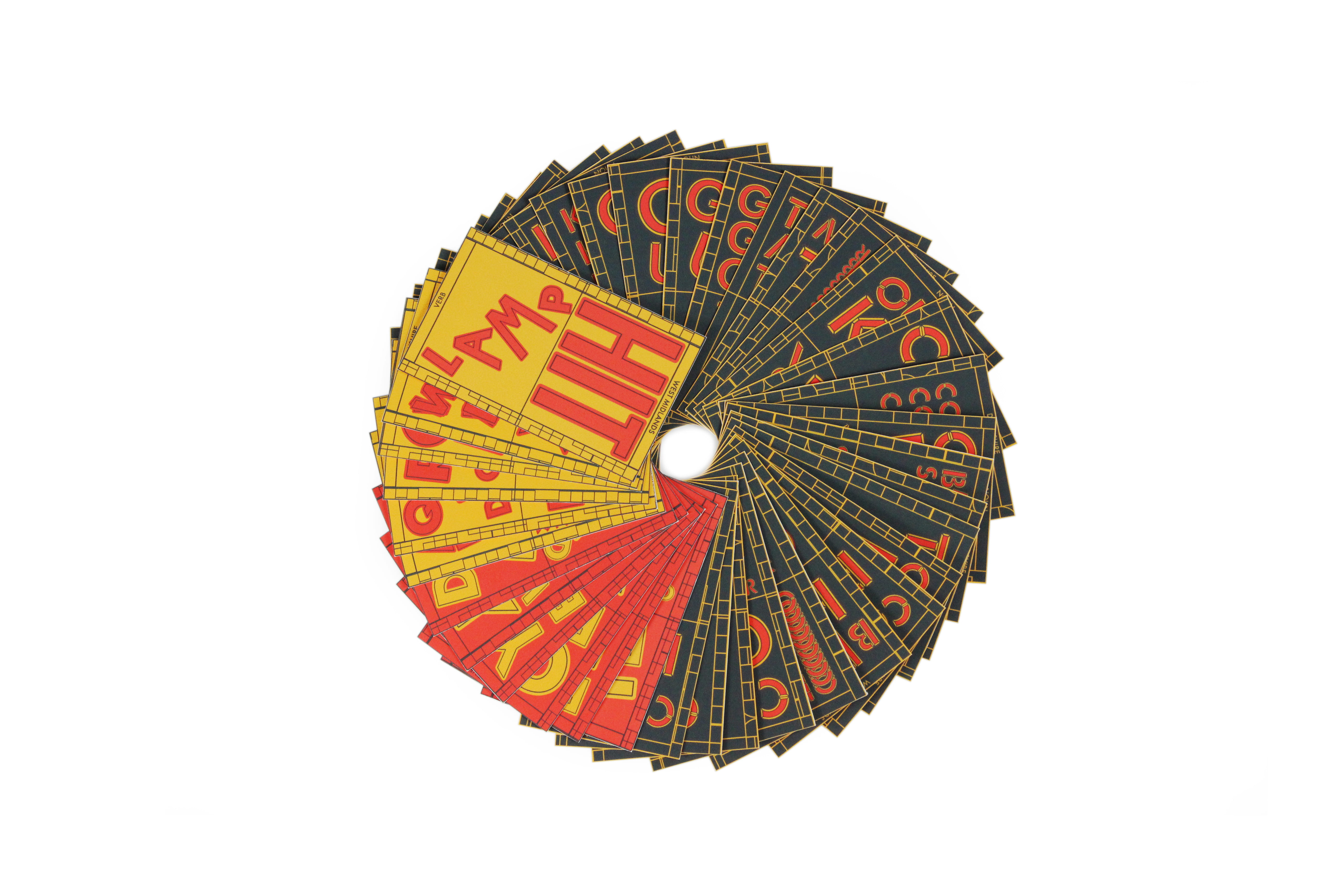 A deck of yellow, red and black cards fanned out in a circle. 