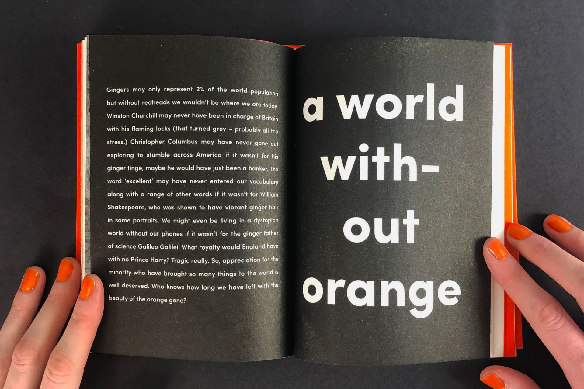 An open book with 'a word without orange' across one page.