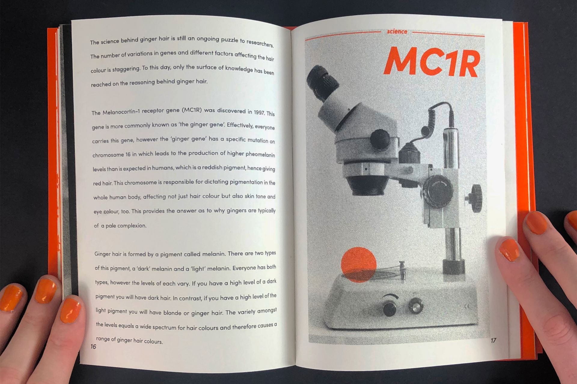 An open book with a picture of a microscope.