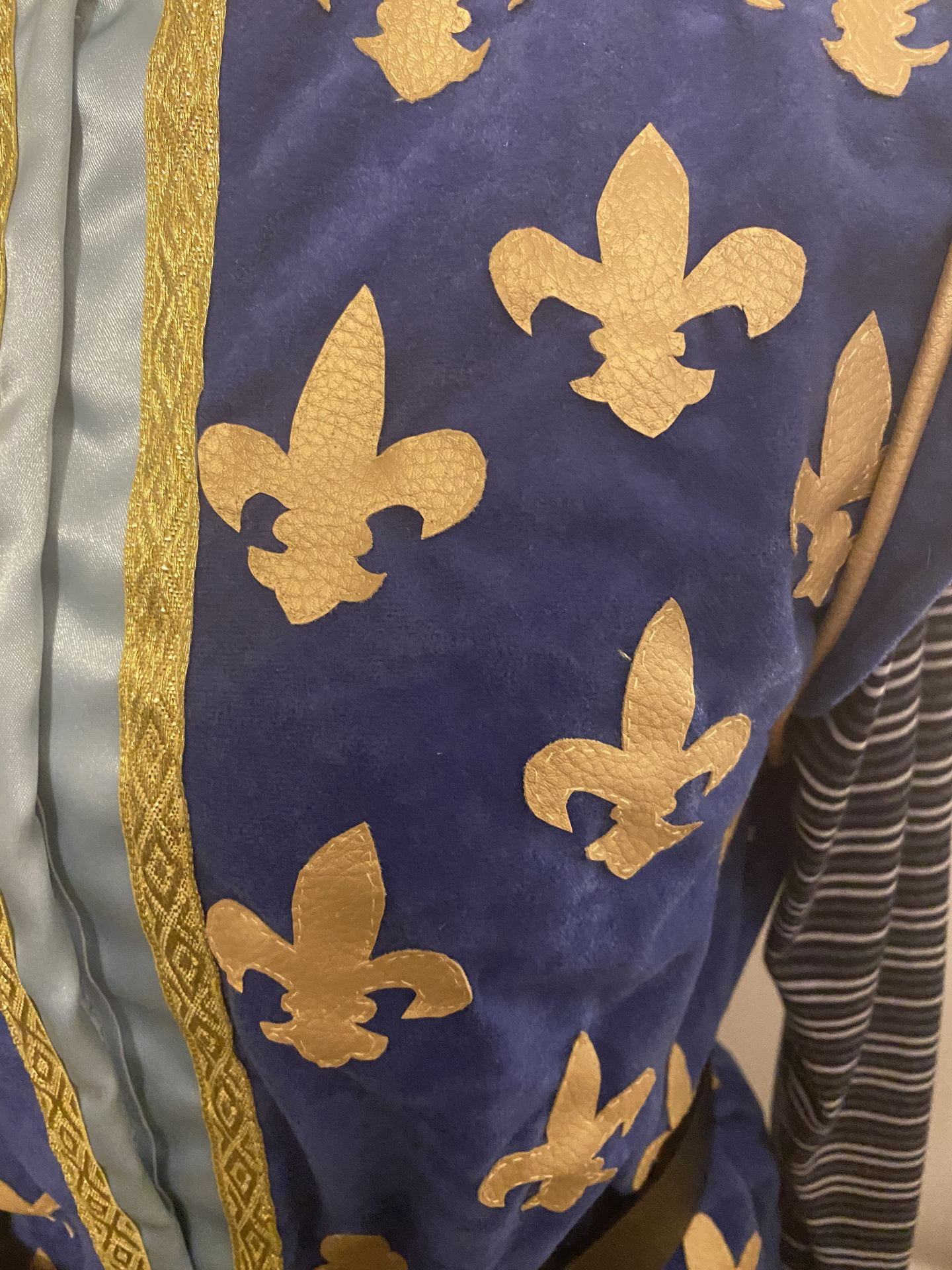 Close up for the blue and gold bodice details. Shoes the gold details and the stitching.