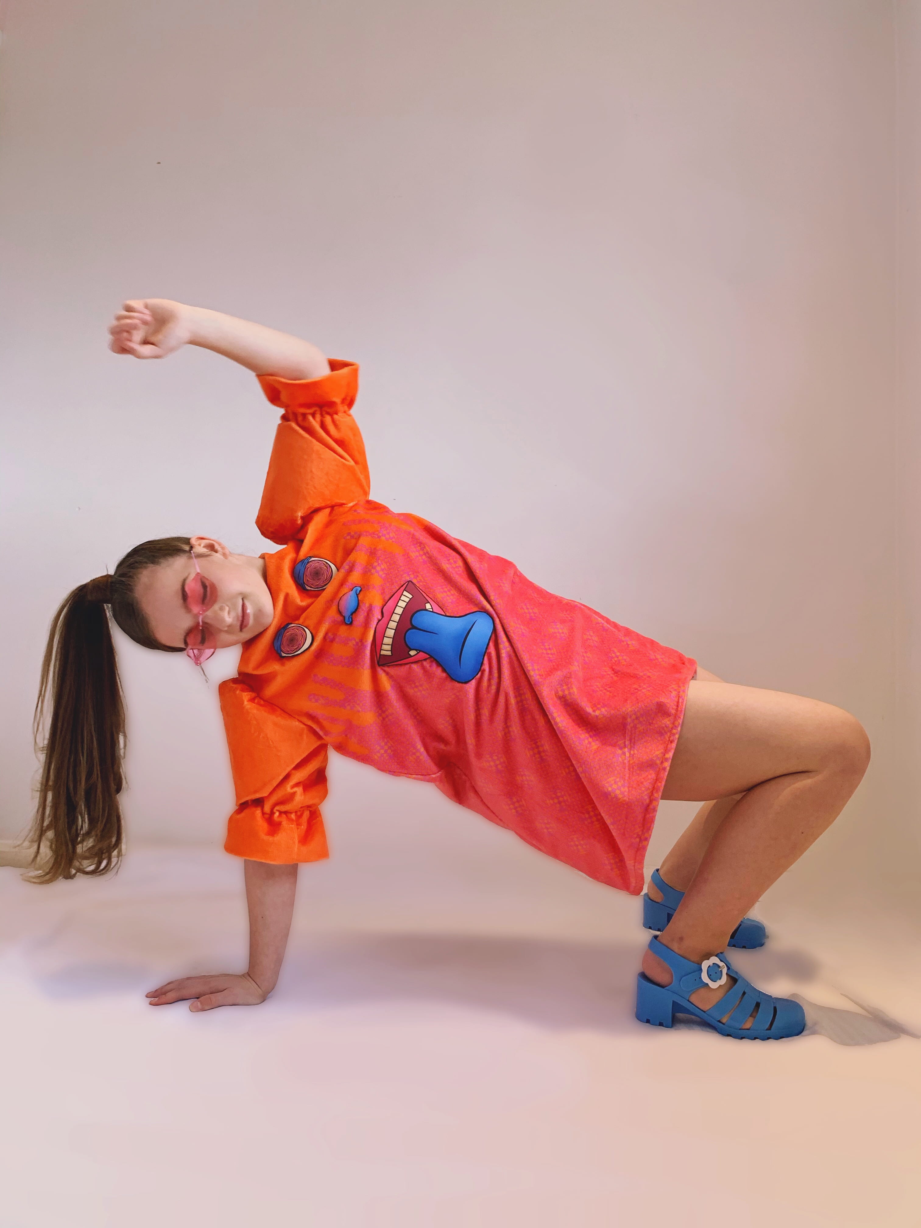 Photograph of a girl posing on the floor in an item in the 'Let's Get Trippy' collection.