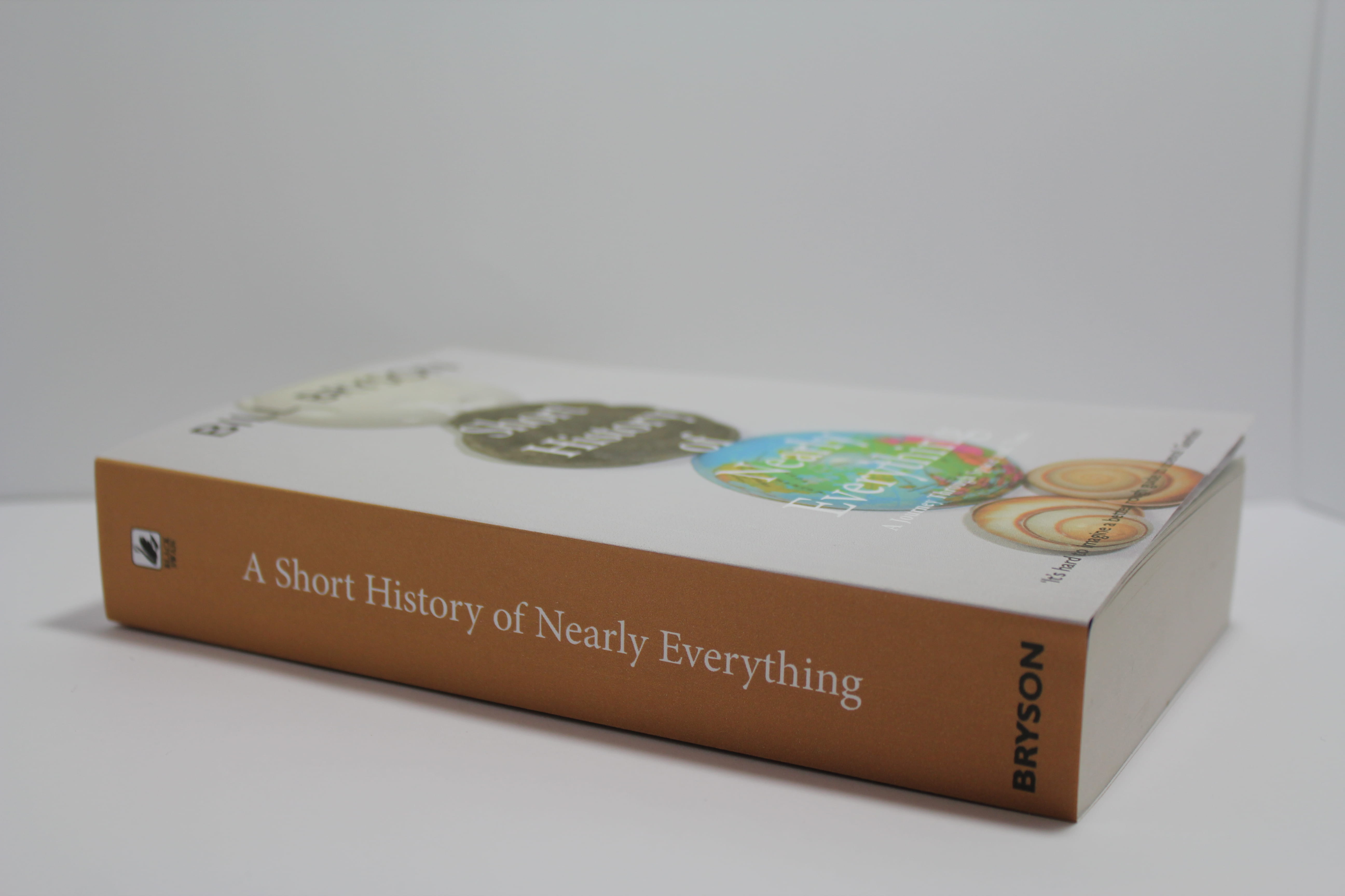 Photographic cover with stacked shells on a globe on Bill Bryson's 'A short history of nearly everything'.