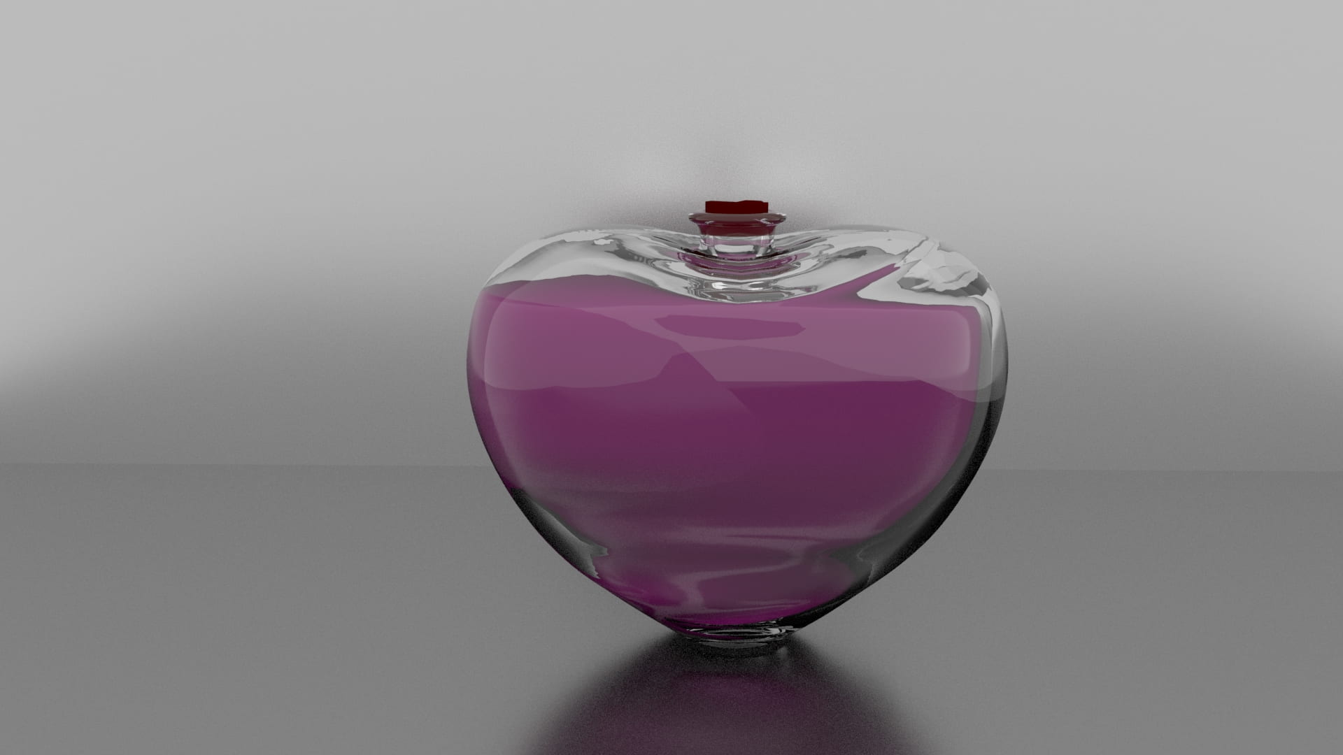 Heart shaped bottle of a pink liquid.