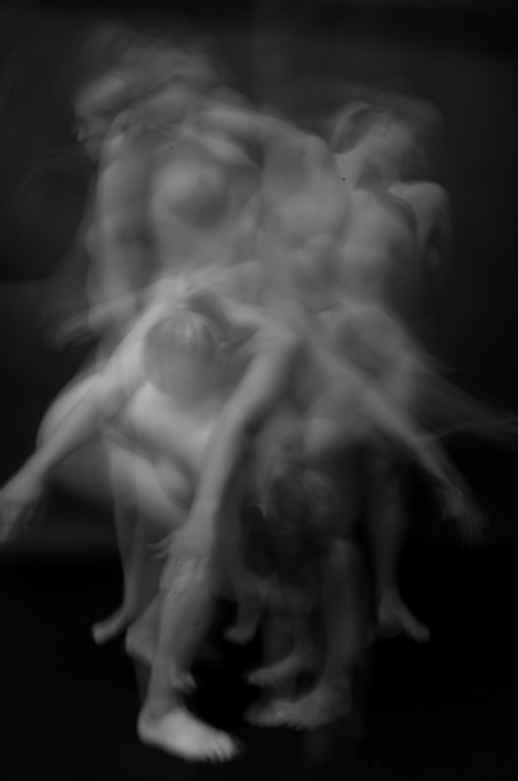 Blurred black at white photography of nude women in multiple poses.