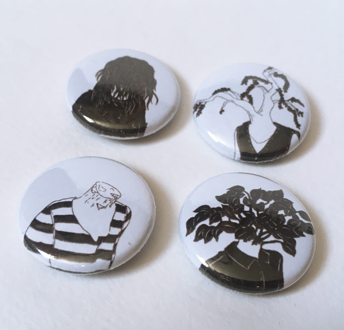 Image of pin badges created to sell on my online store.